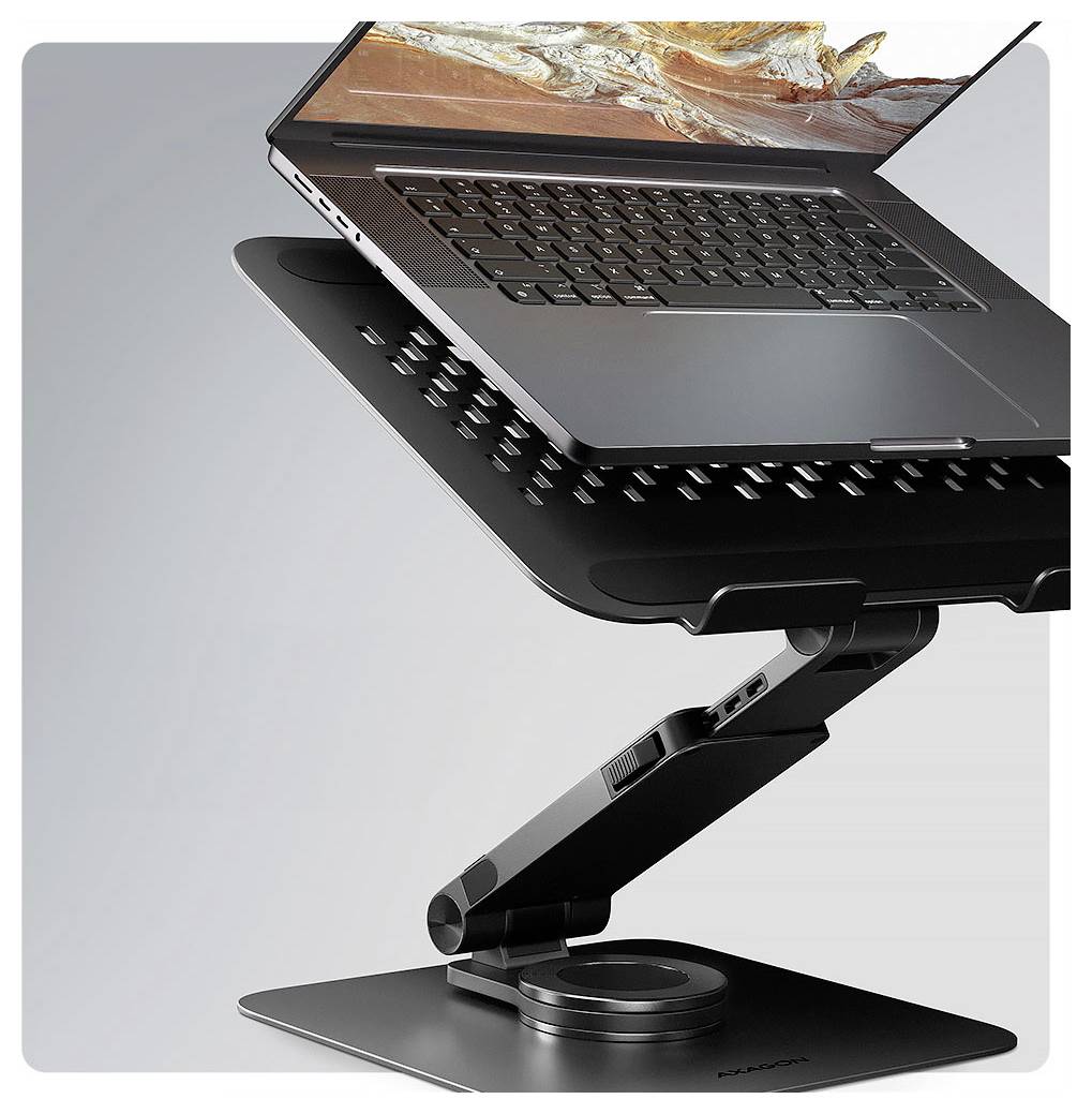 Nastavitelný stojan na notebook zvedající notebook, zvyšující ergonomické pohodlí. Obsahuje sklopný mechanismus a elegantní, moderní design.