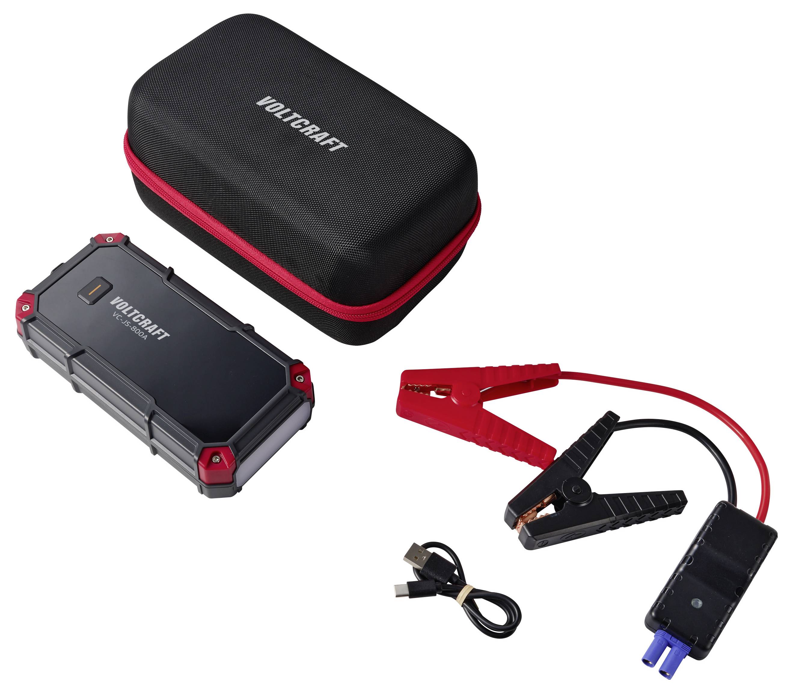 Voltcraft přenosný startovací set s pevným pouzdrem, svornými kabely, USB nabíjecím kabelem a adaptérem napájení.