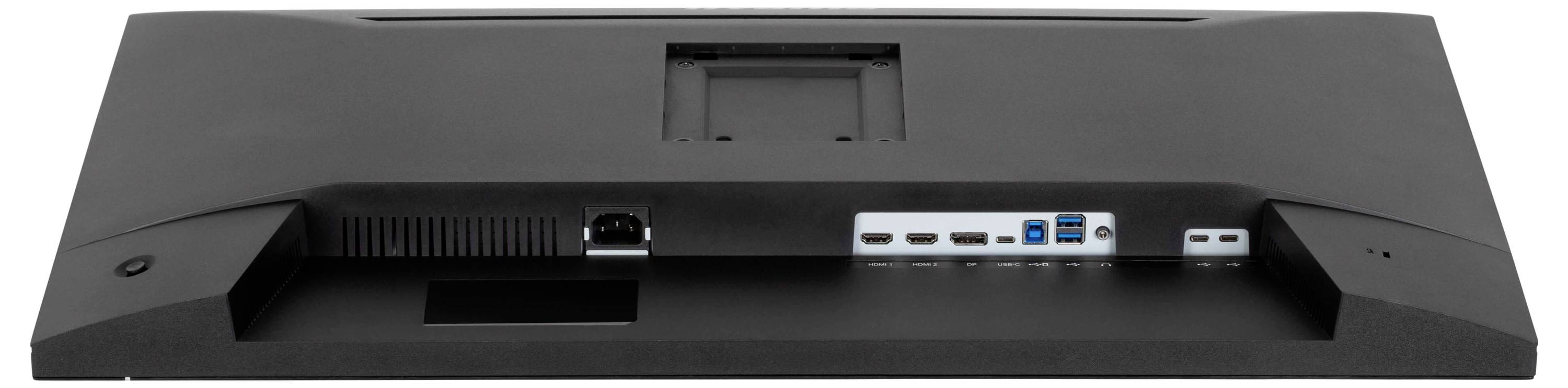 Zadní panel počítačového monitoru zobrazující různé porty včetně HDMI, USB a napájecího konektoru, vhodný pro všestranné připojení.