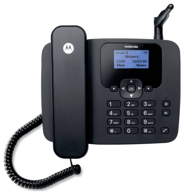 Černý stolní telefon s drátěnou sluchátkem, displej zobrazující „Network" a „10/12/18", a klávesnice s čísly a funkčními tlačítky.