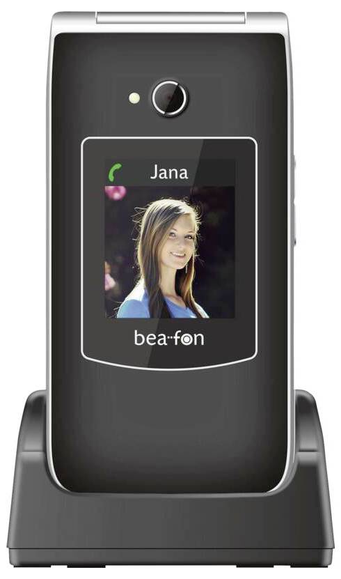 Mobilní telefon s otevíracím mechanismem v dokovací stanici zobrazuje kontakt jménem "Jana" s fotografií a indikuje příchozí hovor. Je viditelná značka "bea-fon".