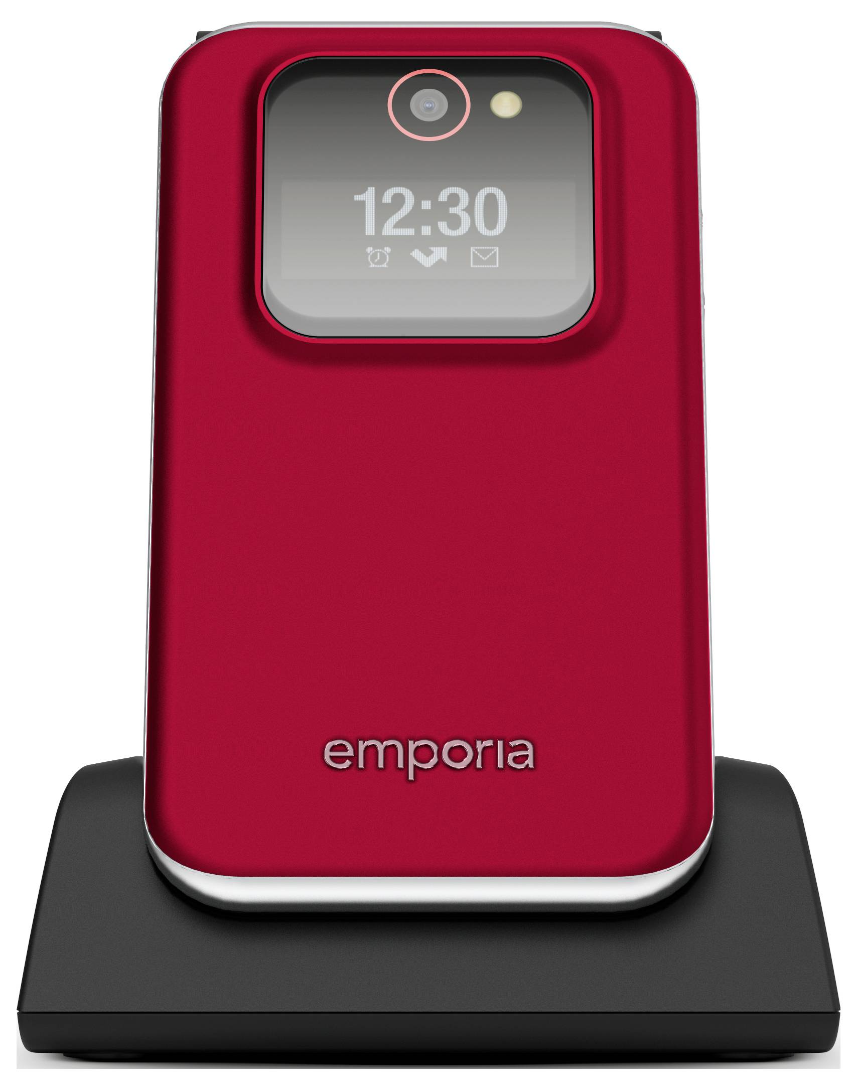 Červený skládací telefon s digitálním displejem hodin zobrazujícím '12:30' na černé nabíjecí stanici. Na telefonu je viditelný název značky 'emporia'.