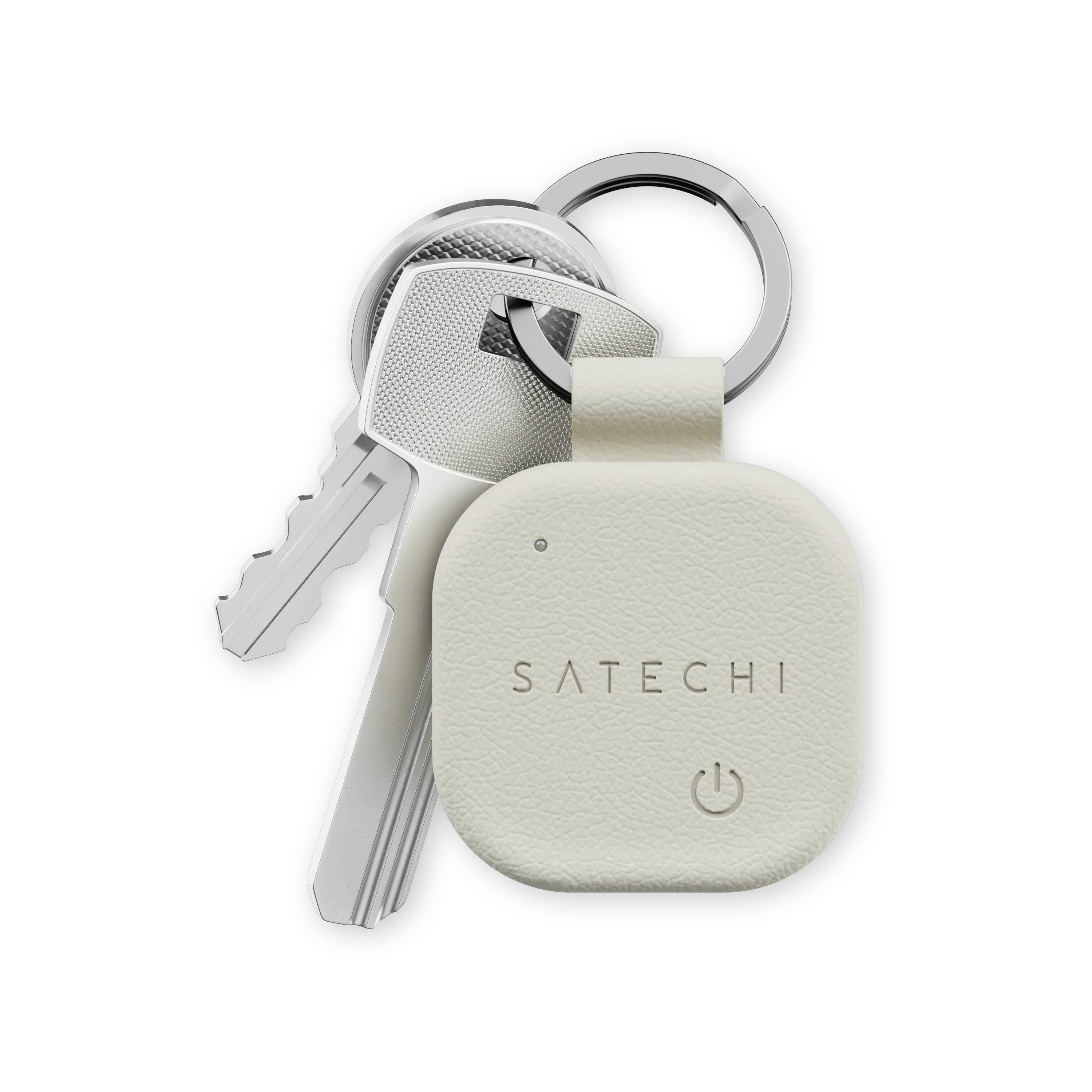 Sada klíčů připevněných ke sledovači Satechi Bluetooth, plochý a béžový design, určený k vyhledávání ztracených předmětů.
