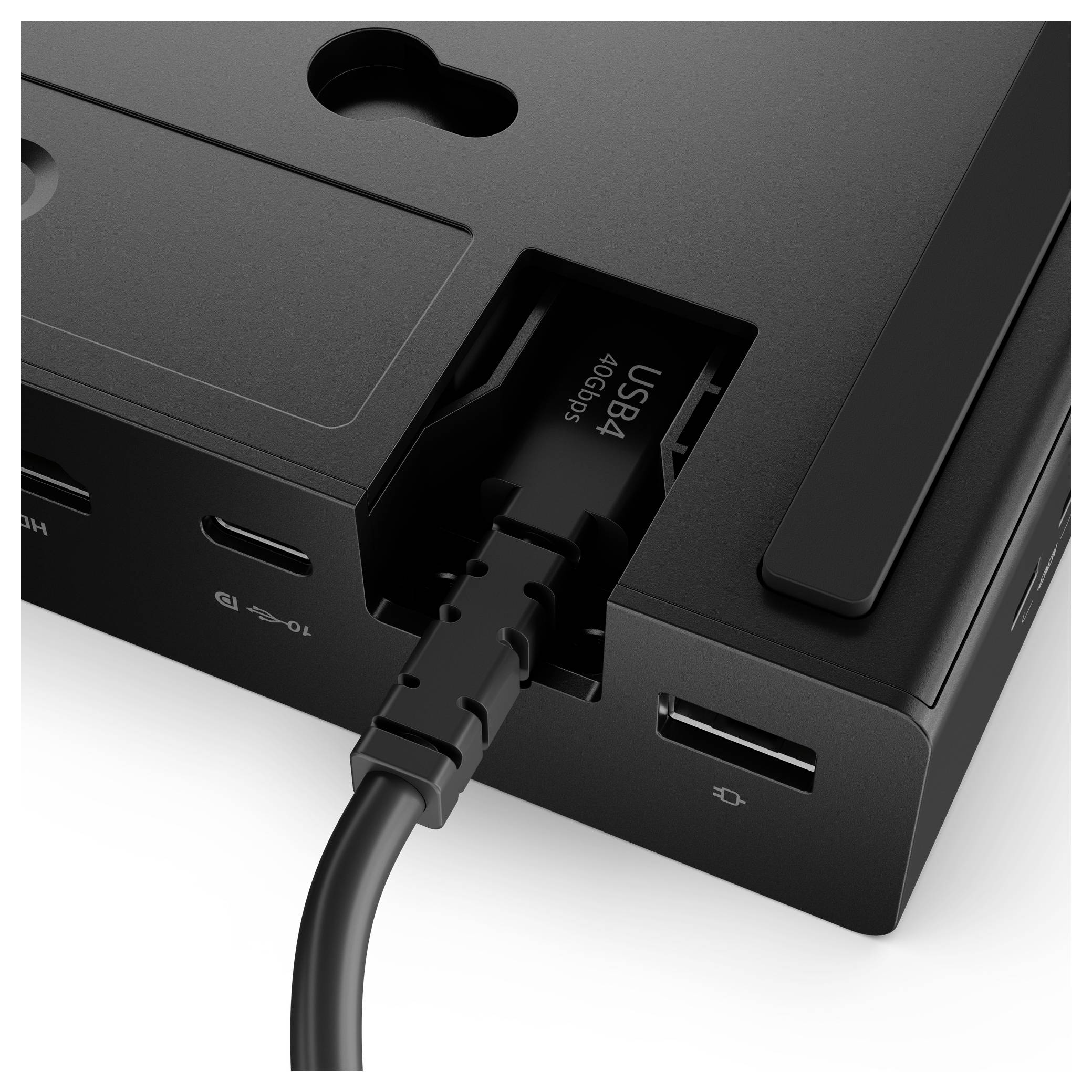 Černá dokovací stanice s porty USB, HDMI a sítěovými porty, s připojeným kabelem USB4 ukazujícím schopnost přenosu rychlostí 100 Gbps.