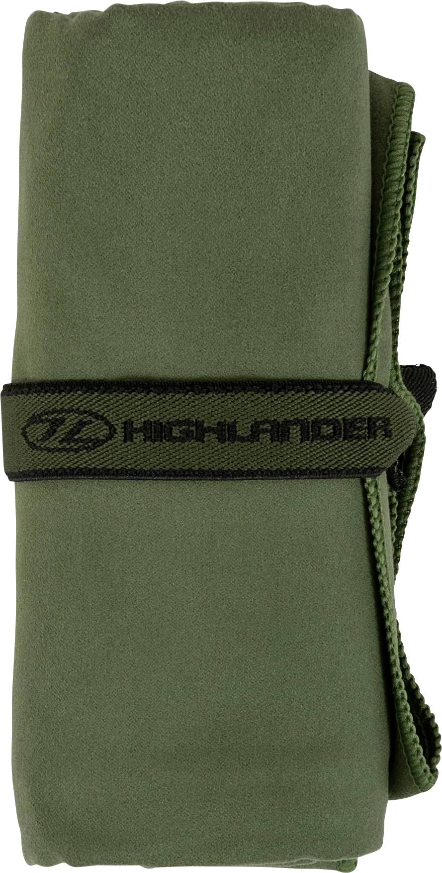 Svinutý zelený ručník zajištěný černým páskem se štítkem "Highlander".