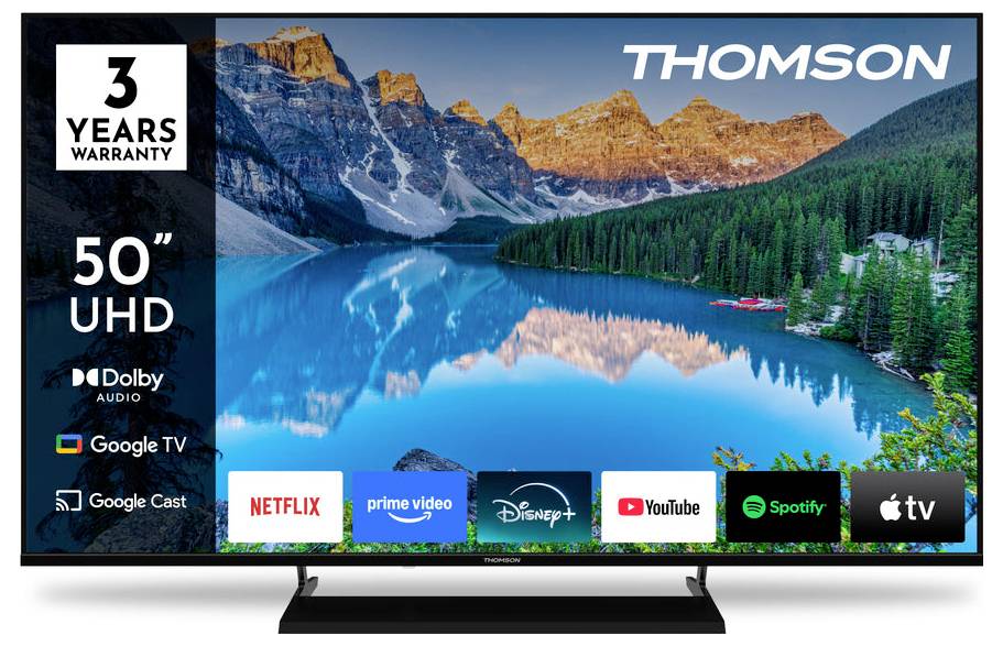 Thomson 50" UHD TV displej ukazující scenérii horského jezera. Mezi funkce patří Dolby Audio, Google TV a aplikace jako Netflix a YouTube.