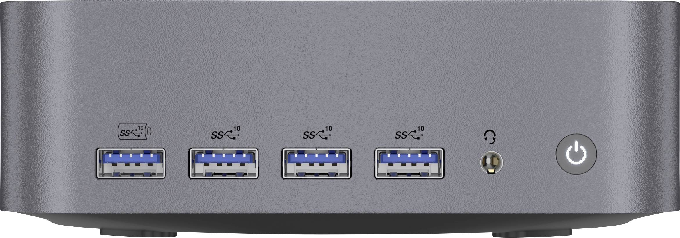 Přední panel malého počítače ukazující čtyři porty USB-A, audio jack pro sluchátka a kulatý tlačítko napájení na pravé straně.