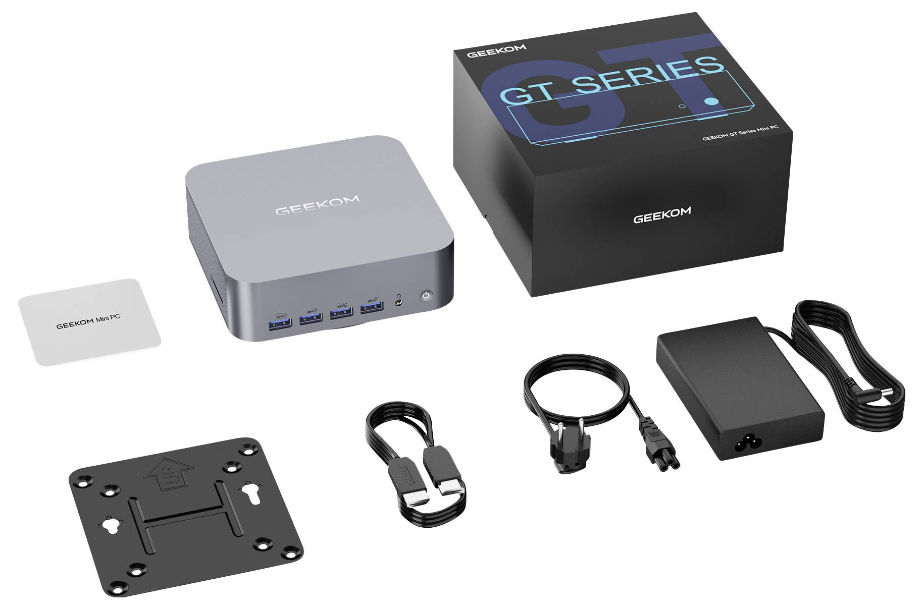 Sada mini PC Geekcom GT Series s kompaktním počítačem, originální krabicí, montážní deskou, napájecím adaptérem, napájecím kabelem a příslušenstvím HDMI/USB.