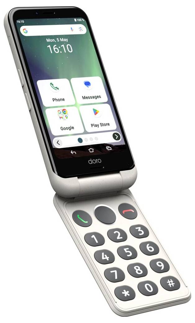 Stříbrný skládací telefon s velkými tlačítky a základní obrazovkou zobrazující čas a datum. Aplikace zahrnují „Telefon", „Zprávy" a „Play Store".