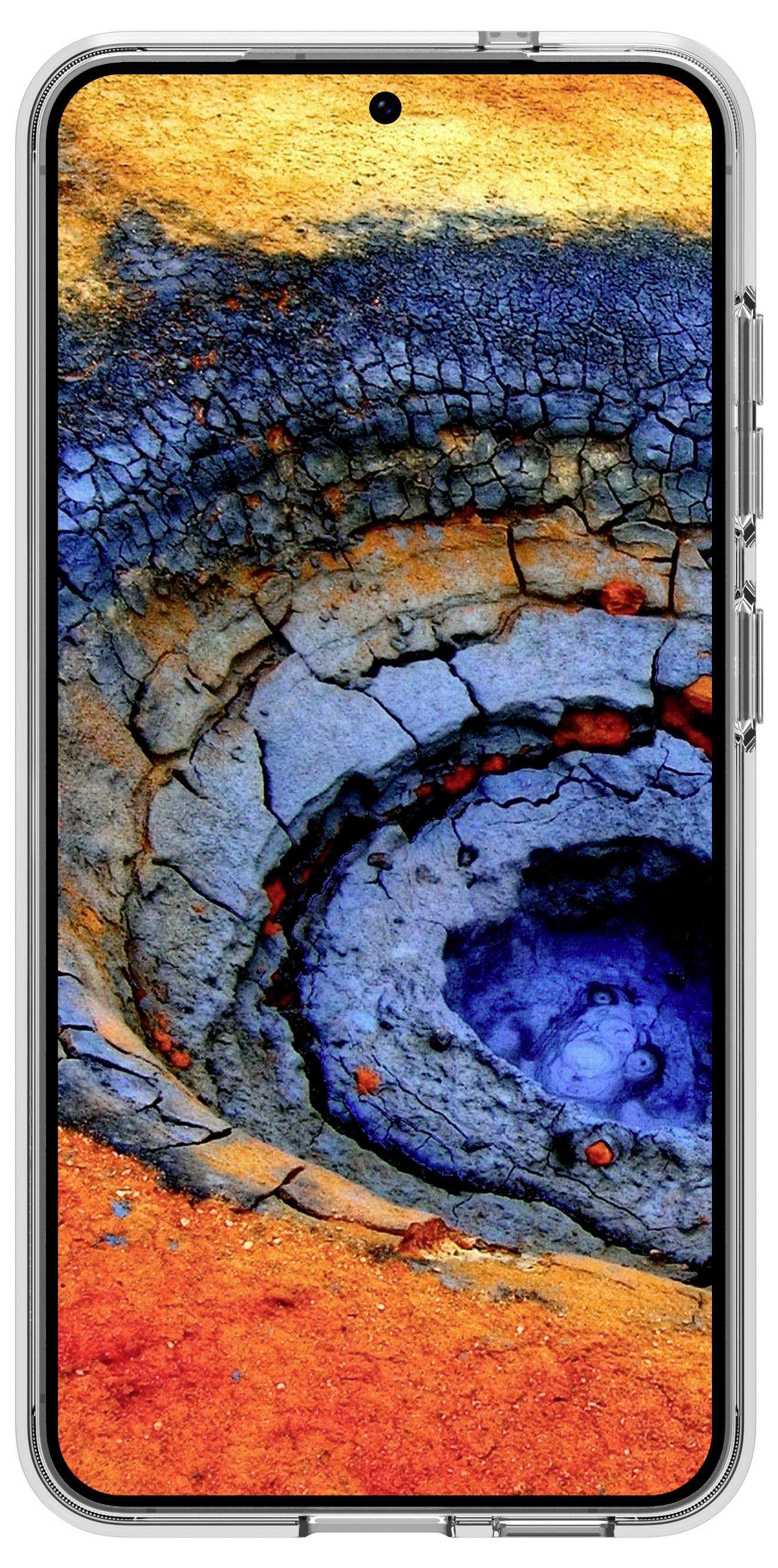 Smartphone zobrazuje abstraktní obrázek soustředných kruhových vzorů v živé oranžové, modré a šedé barvě, který připomíná barevný kráter.