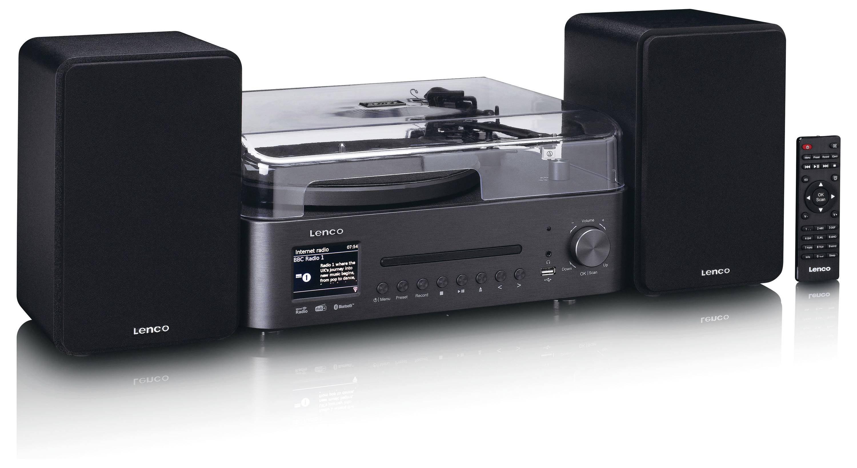 Černý stereo systém s gramofónem, dvěma reproduktory a dálkovým ovladačem. Displej ukazuje "Vinyl Music".