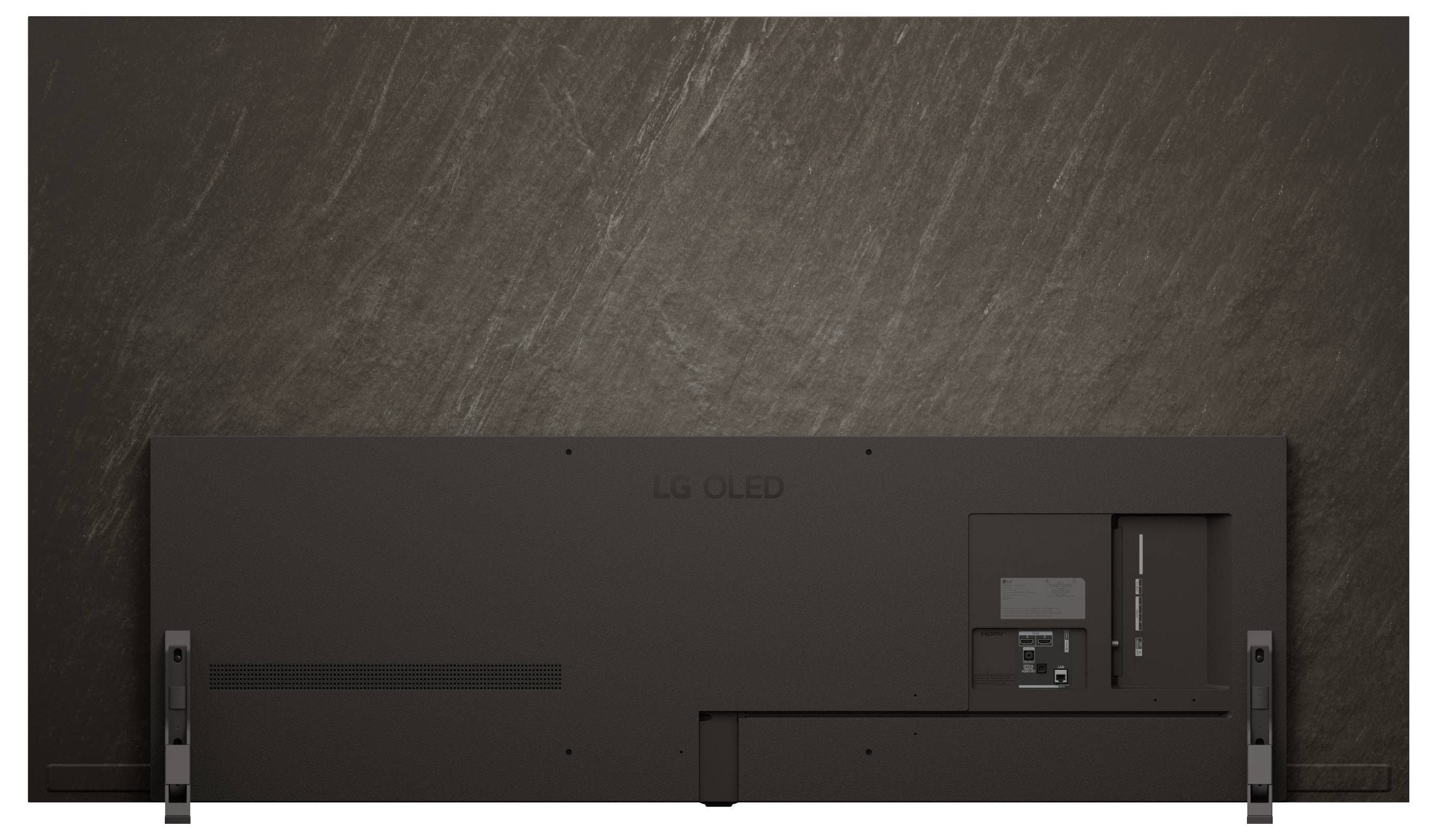 Pohled zezadu na velký OLED televizor LG na stojanu, zobrazující zadní panel, porty a nástěnné konzole.