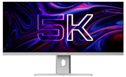Monitor zobrazuje velký neonový text „5K" na barevném abstraktním pozadí.