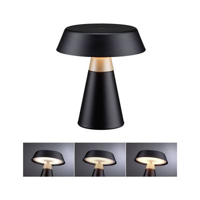 Moderní stolní lampa ve tvaru houby v černé barvě se zlatým akcentem, zobrazená nad třemi malými pohledu svícení, které ilustrují lampu v zapnutém stavu.