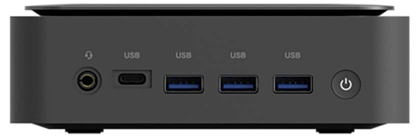 Přední pohled zařízení s jedním audio jackem, čtyřmi porty USB označenými „USB" a kulatým tlačítkem napájení na pravé straně.