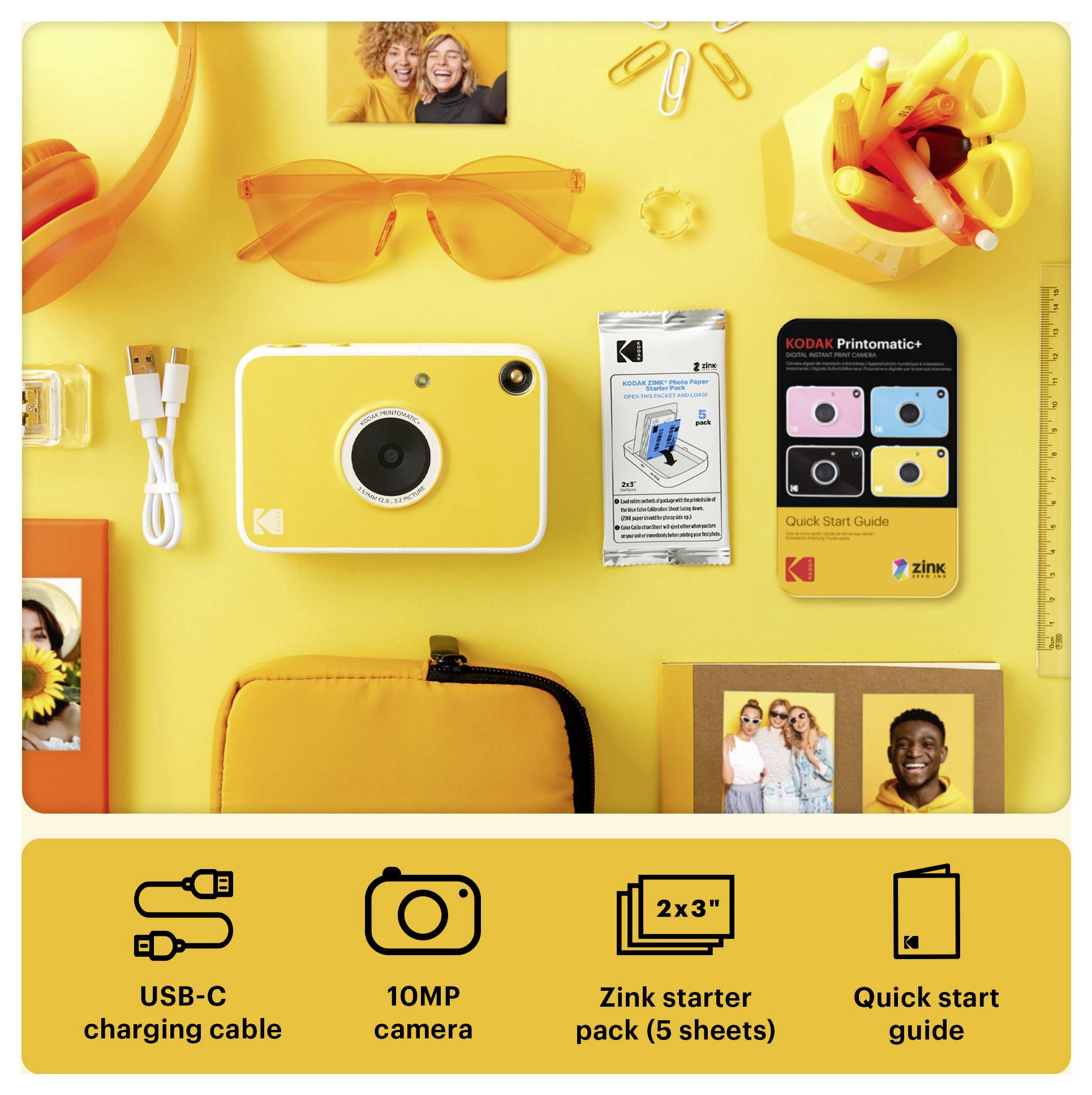 Žlutá instantní kamera Kodak s kabelem USB-C, startovací balíček Zink, příručka rychlého startu a příslušenství uspořádané na jasně žlutém pozadí.