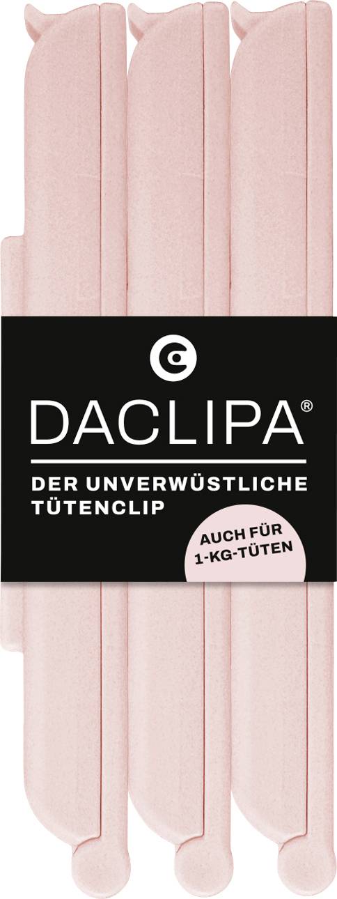 Růžový balíček DACLIPA spínáčů na tašky s černým štítkem a německým textem „DER UNVERWÜSTLICHE TÜTENCLIP" a „AUCH FÜR 1-KG-TÜTEN" na vertikálním přepážkovém displeji.