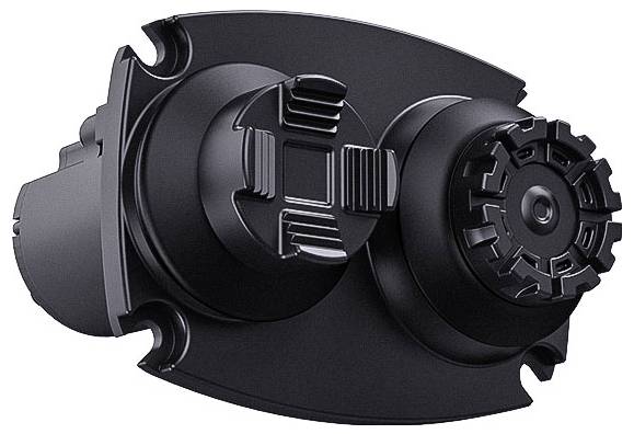 Černé plastové mechanické zařízení se dvěma kruhovými knoflíky a středním drážkovaným otočným kolečkem na oválné podstavě, zobrazené na bílém pozadí