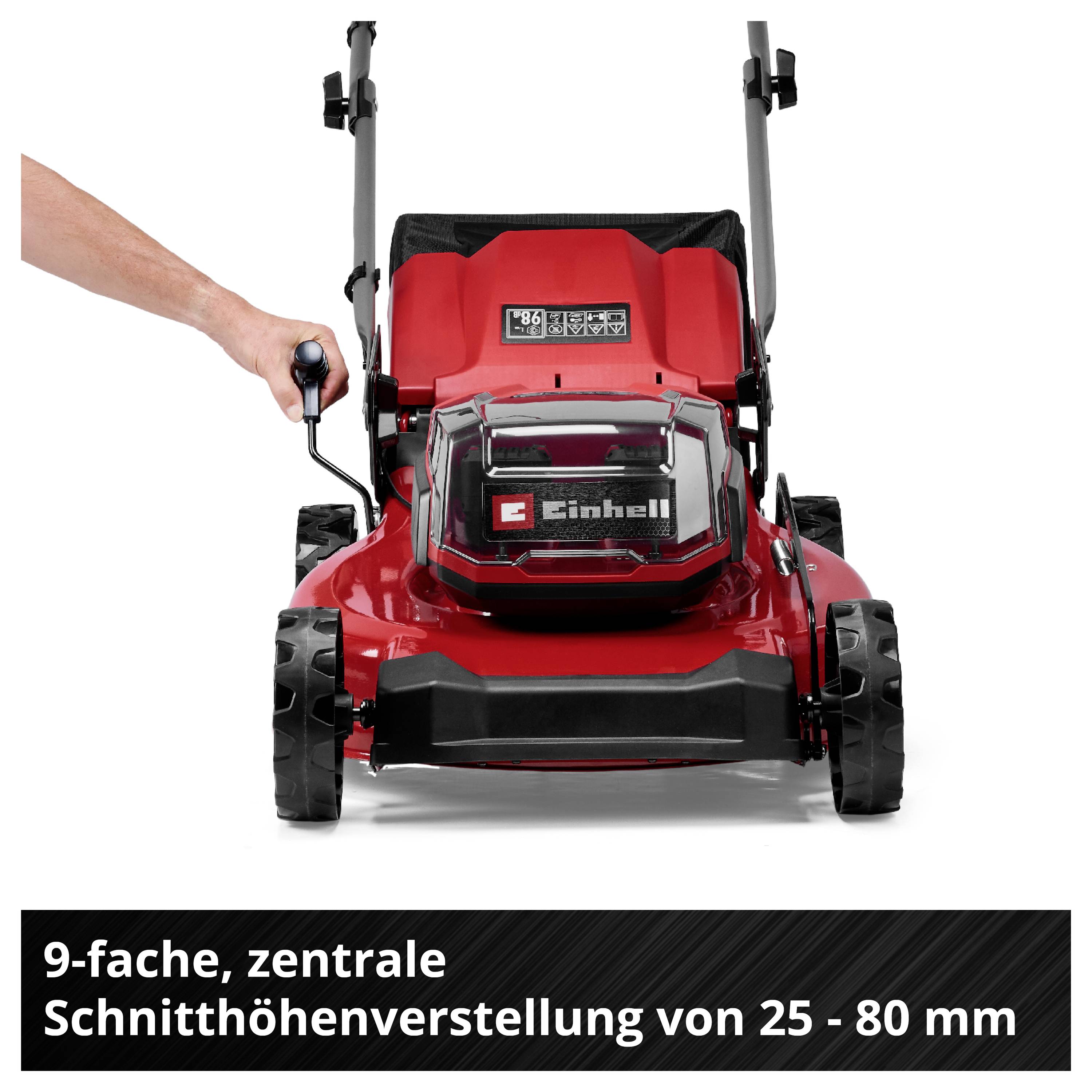 Červený sekačka na trávu Einhell s ruční pákou; upozornění na 9násobné centrální nastavení výšky střihu od 25 do 80 mm.