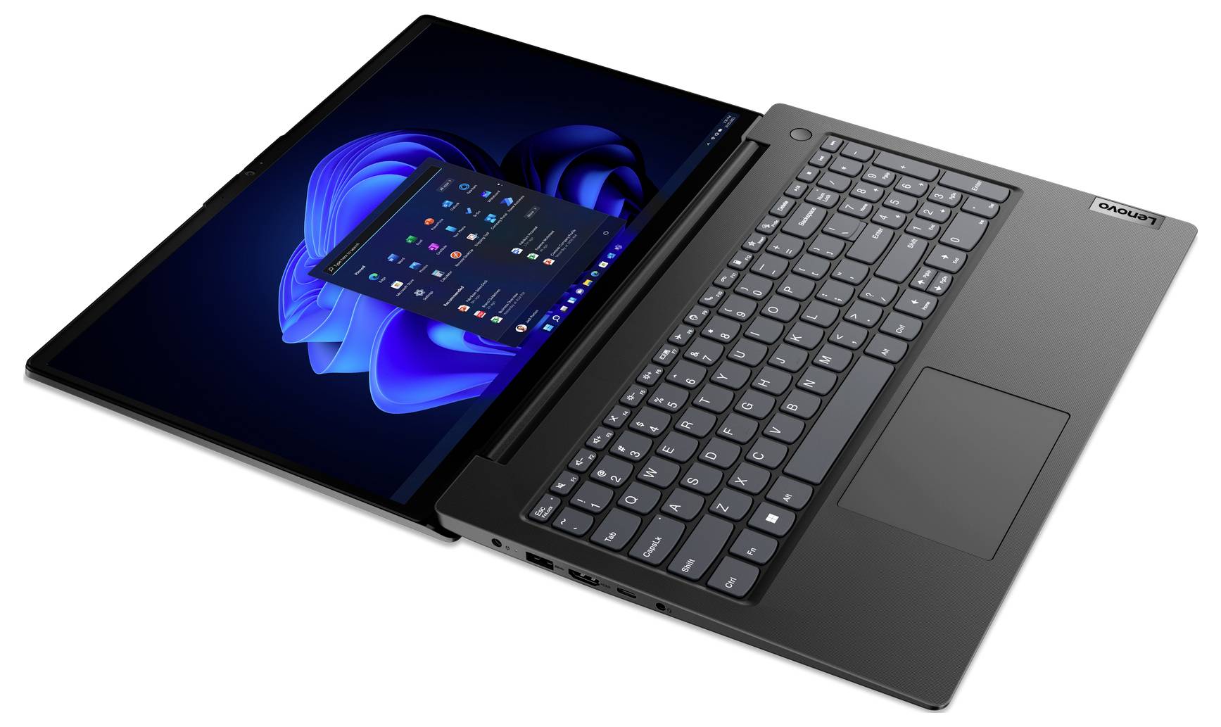 Šedý notebook Lenovo zobrazený otevřený s desktopem Windows 11 na obrazovce, nakloněný na bílém pozadí.