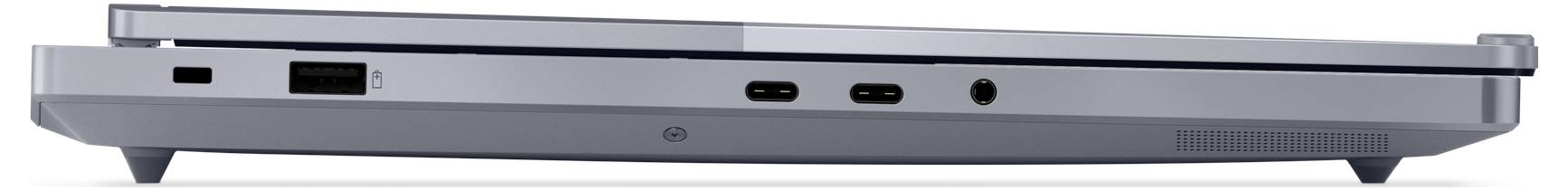 Pohled zezadu na stříbrný uzavřený notebook, ukazující přední hranu s porty včetně USB-C a HDMI.
