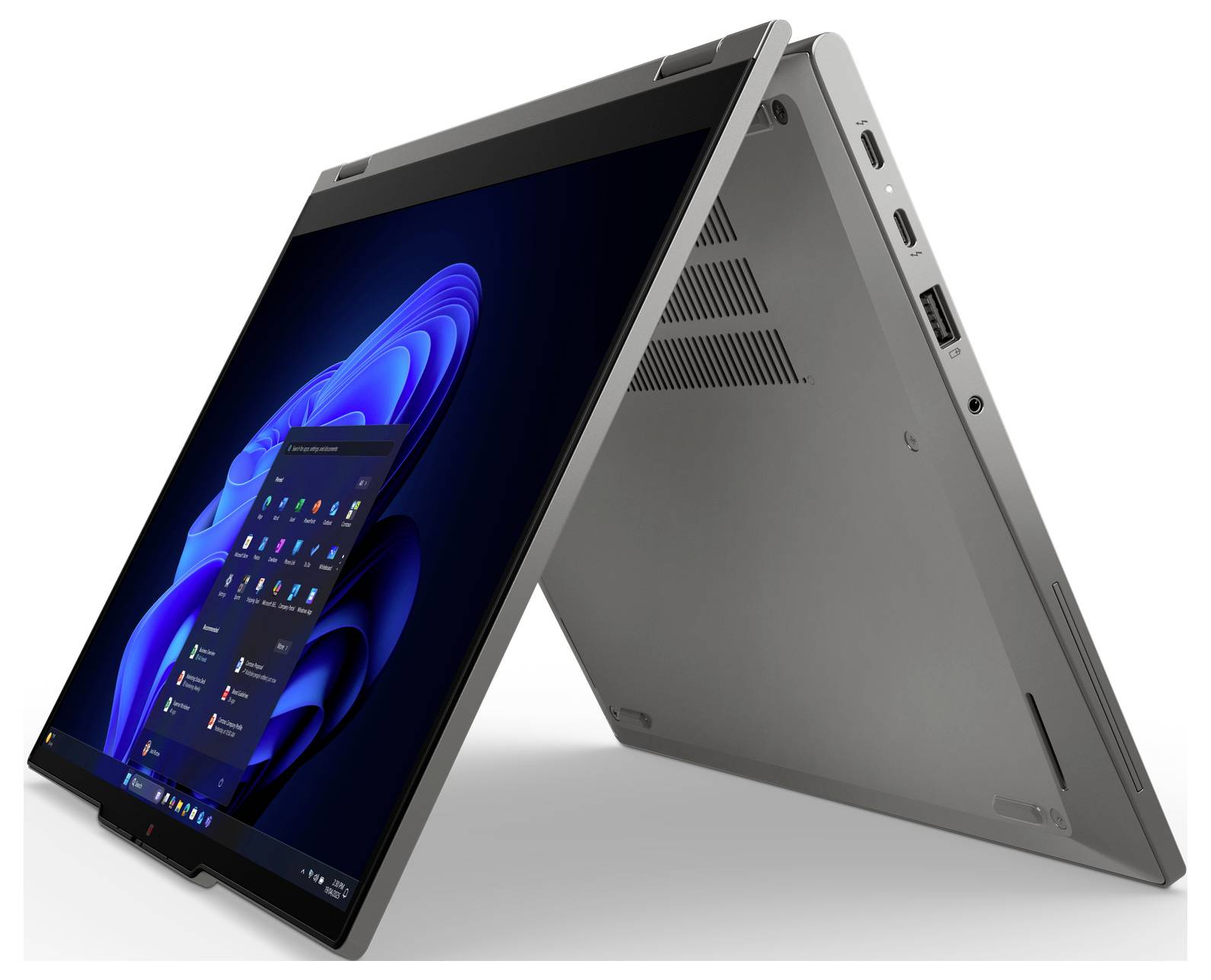 Dvouprvkový přenosný počítač v režimu stanu, zobrazující plochu Windows na dotykové obrazovce s porty a větrací otvory viditelnými na zadní straně.