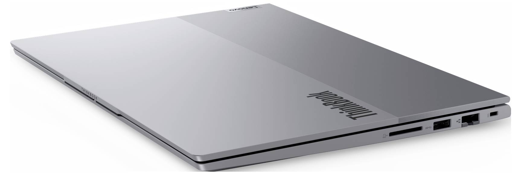 Stříbrný laptop Lenovo ThinkPad zobrazený zavřený v úhlu na bílém pozadí.