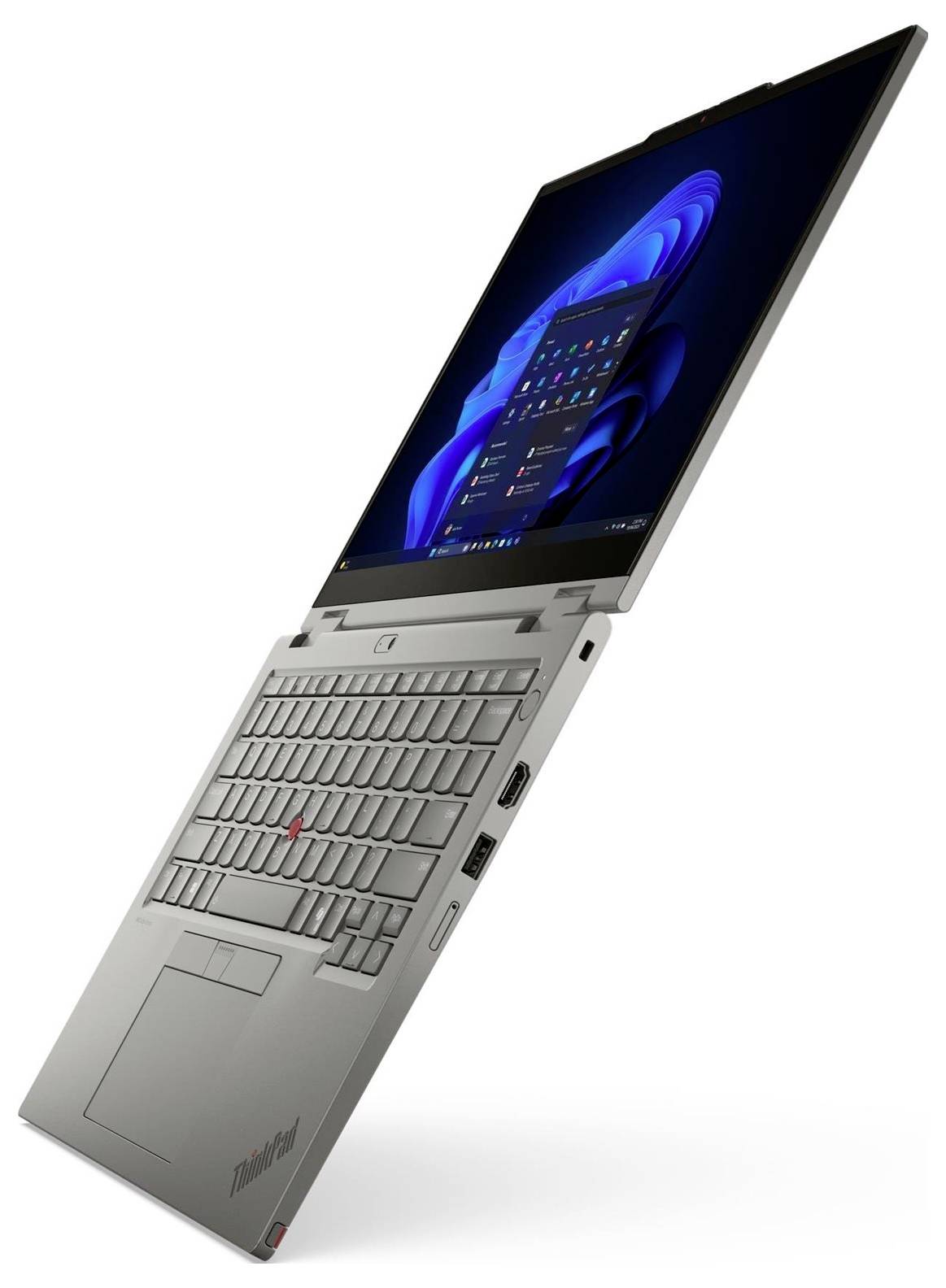 Stříbrný laptopový ThinkPad od značky Lenovo zobrazený částečně otevřený v poloze podobné tabletu, s viditelnou klávesnicí a obrazovkou.