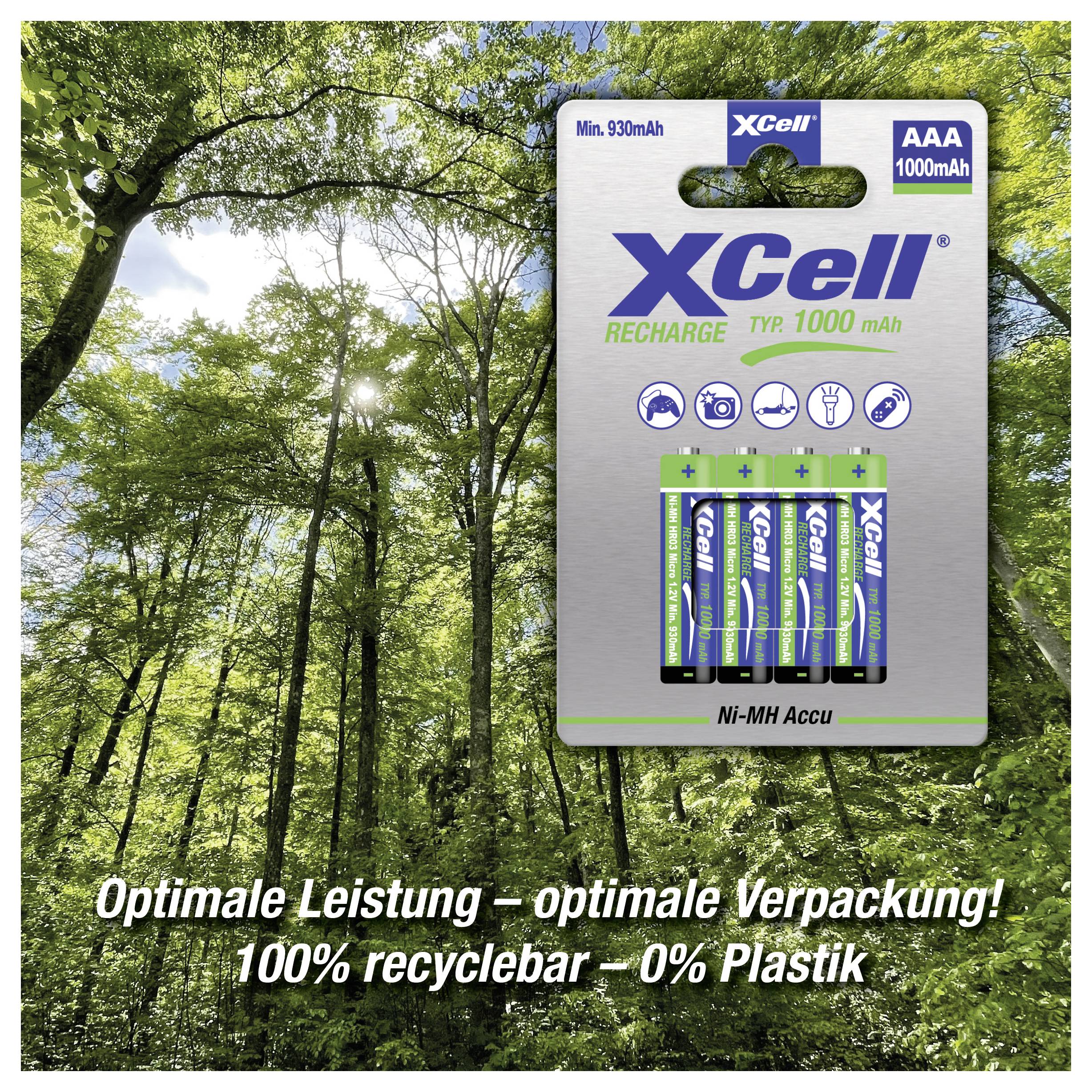 Nabíjecí baterie XCell AAA Ni-MH zobrazená na pozadí lesa, s německým textem propagujícím optimální balení a 100% recyklovatelnost, 0% plastiku.