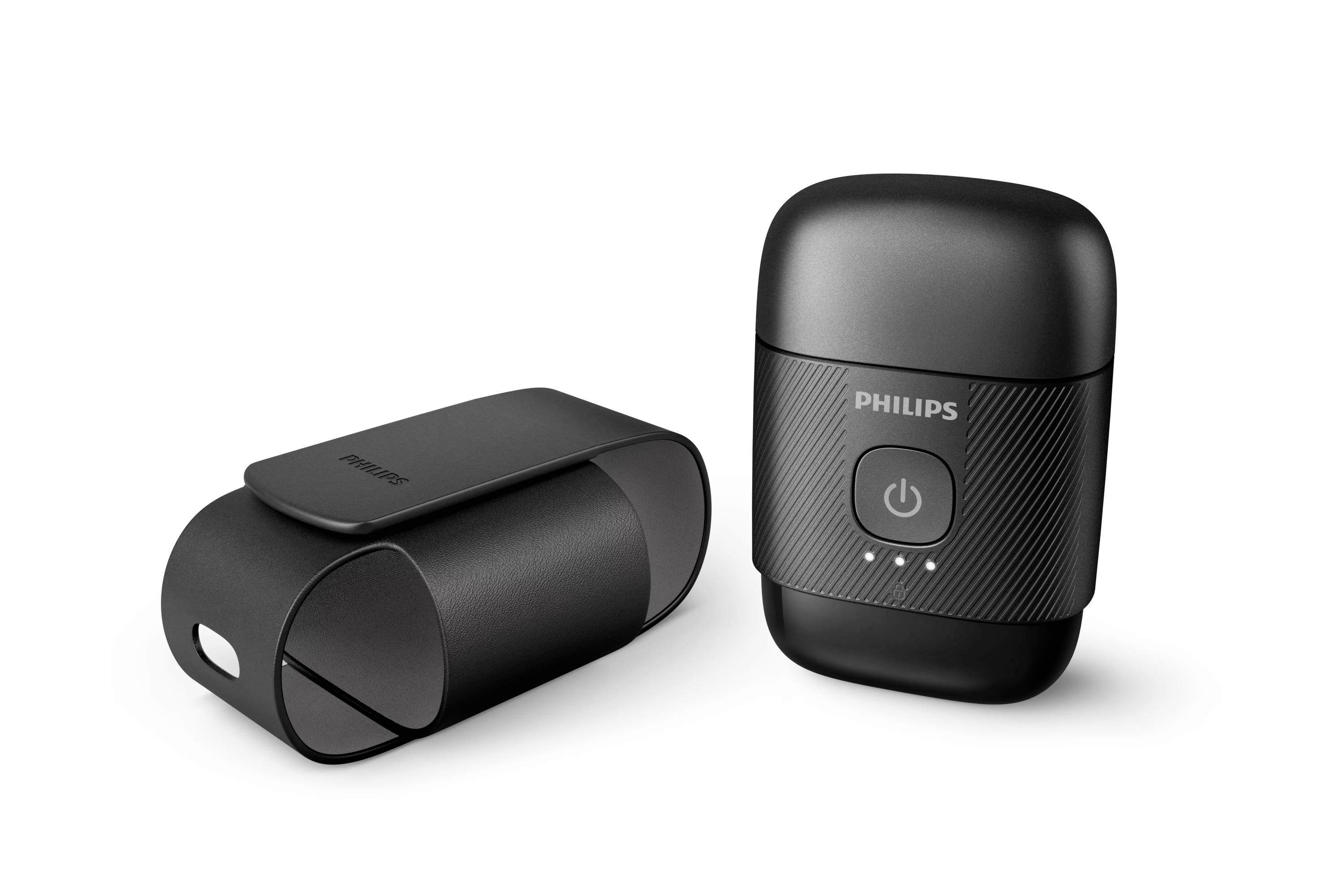 Dvě černé přenosné zařízení Philips na bílém pozadí, jedno vzpřímené s tlačítkem napájení a indikačními světly, jedno ležící na boku.
