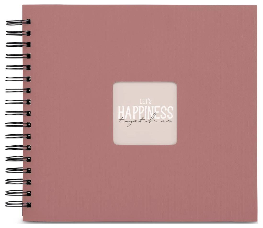 Růžový sešit vázaný na spirálu s centrovaným štítkem s nápisem „POJĎME NA ŠTĚSTÍ společně".