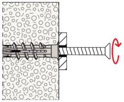 Diagram znázorňující kotvidu stěny vkrucované do duté stěny, s červenou šipkou ukazující rotaci ve směru hodinových ručiček.