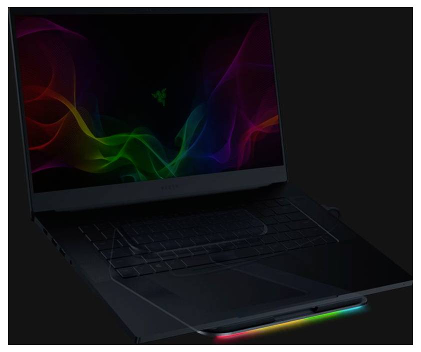 Tmavý herní notebook s živou duhou vlny na obrazovce a RGB osvětleným předním okrajem na černém pozadí.