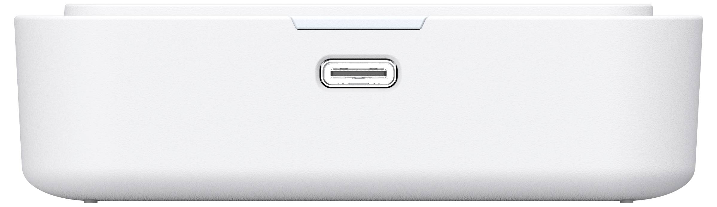 Přední pohled na bílý elektronický dok nebo reproduktor se středovým portem USB-C a zaoblenickou základnou.