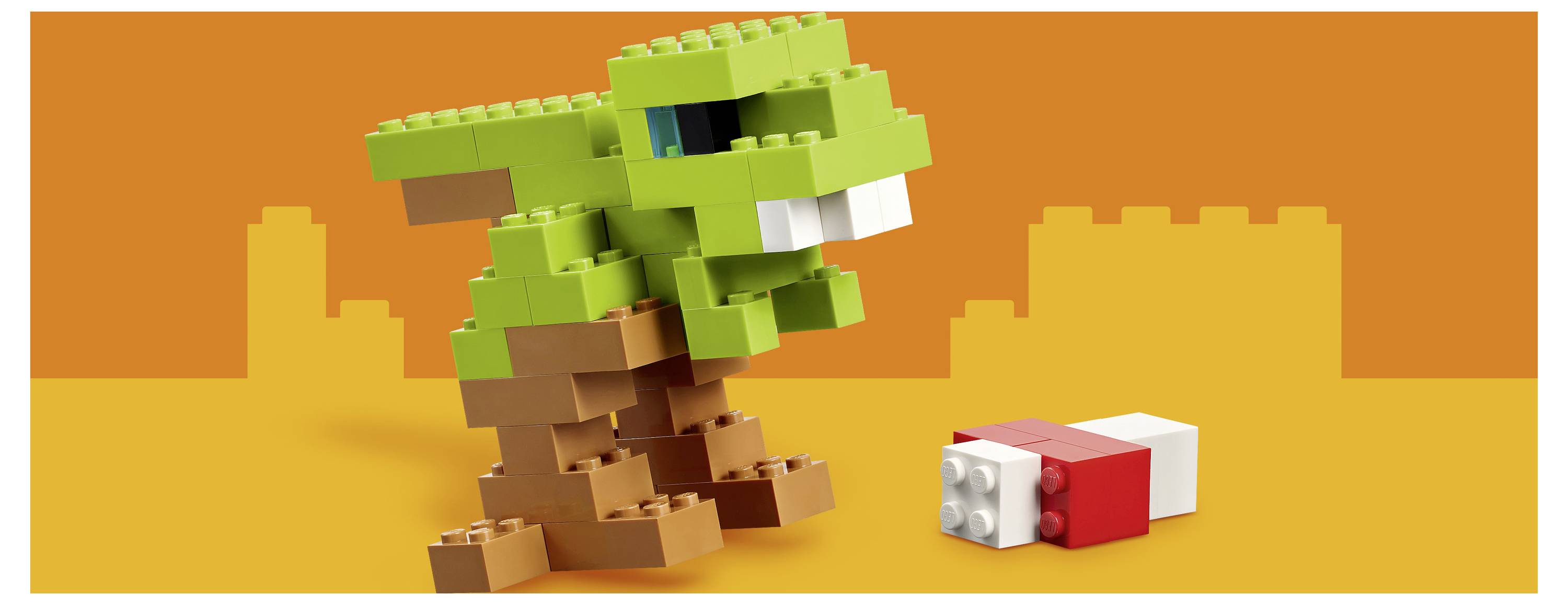 Zelený LEGO-style dinosaurus stojí nad malým červeno-bílým blokem na oranžovém pozadí.