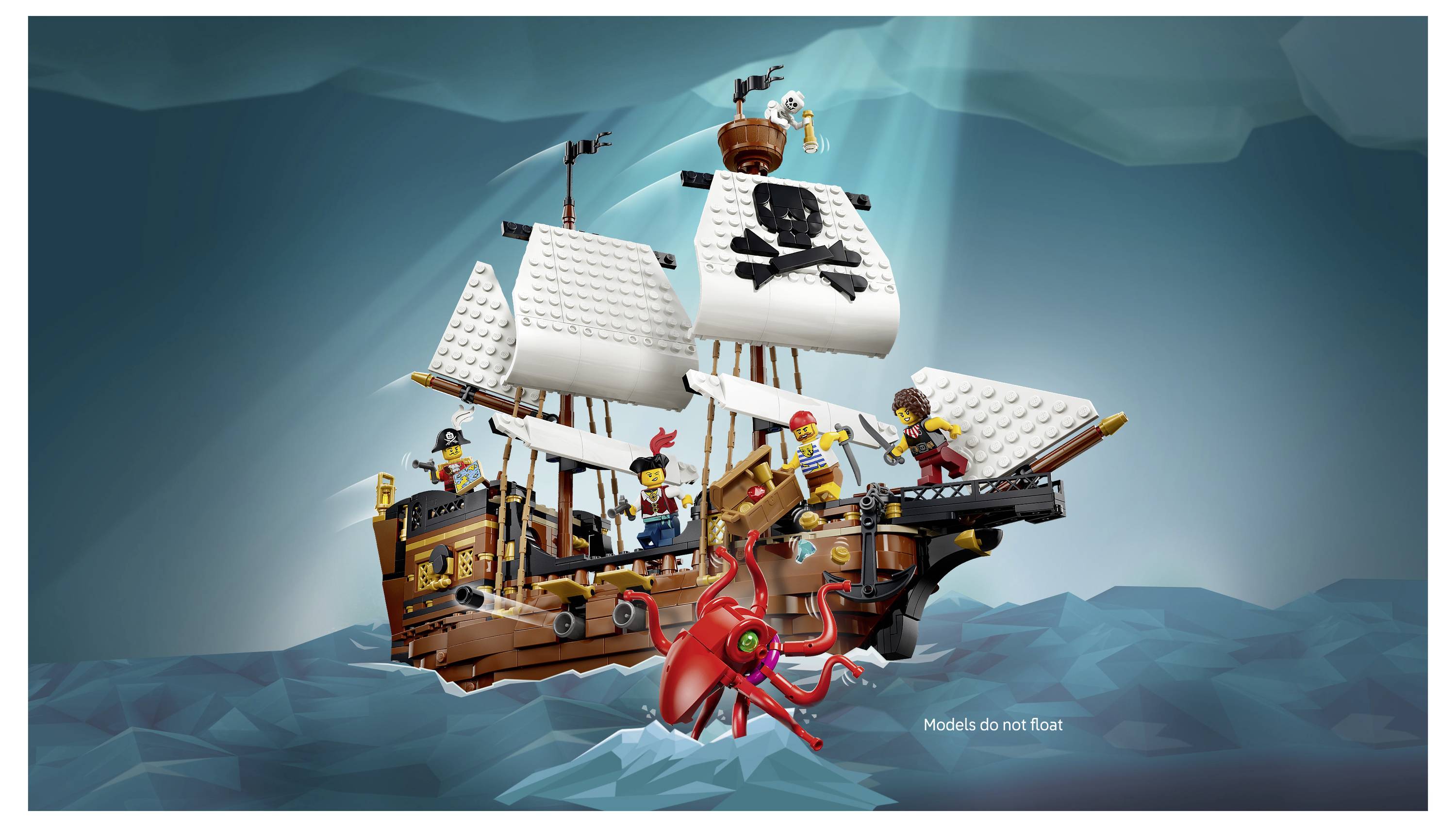 Pirátská loď LEGO plující na stylizované modré vodě, s černými plachtami s lebkou a zkříženými kostmi a červeným mořským monstrem útočícím pod ní; popis zní "Modely se neplavou".