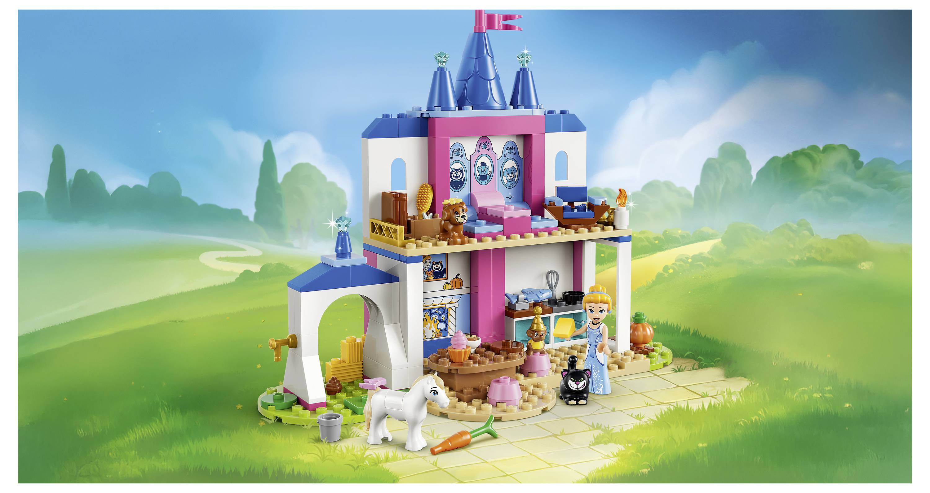 Hrad ve stylu LEGO s figurkou princezny a postavičkami zvířat, včetně bílého jednorožce a malých domácích miláčků, umístěný v jasné trávnaté krajině.