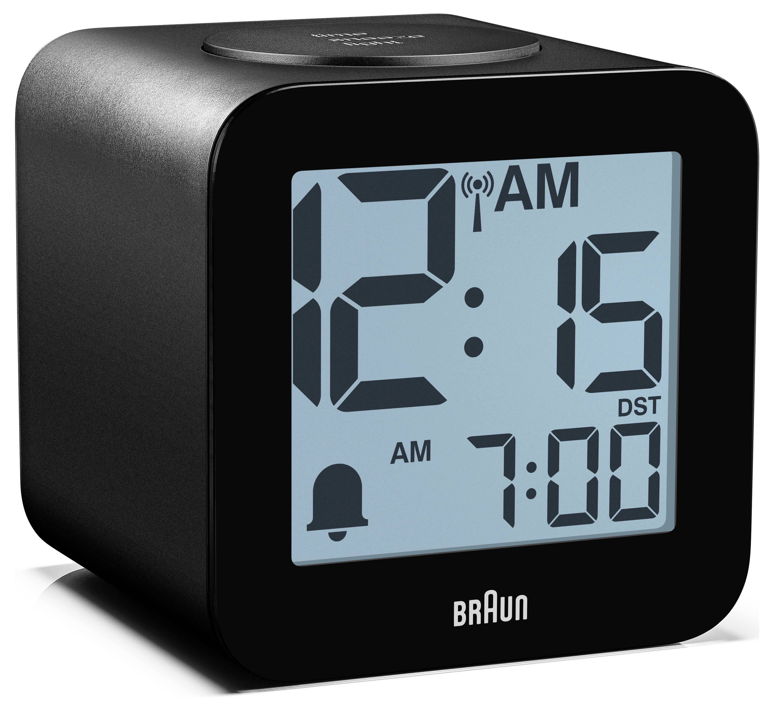 Digitální budík Black Braun zobrazující 12:15 AM s druhotným alarmem 7:00 a ikonou zvonku na displeji.