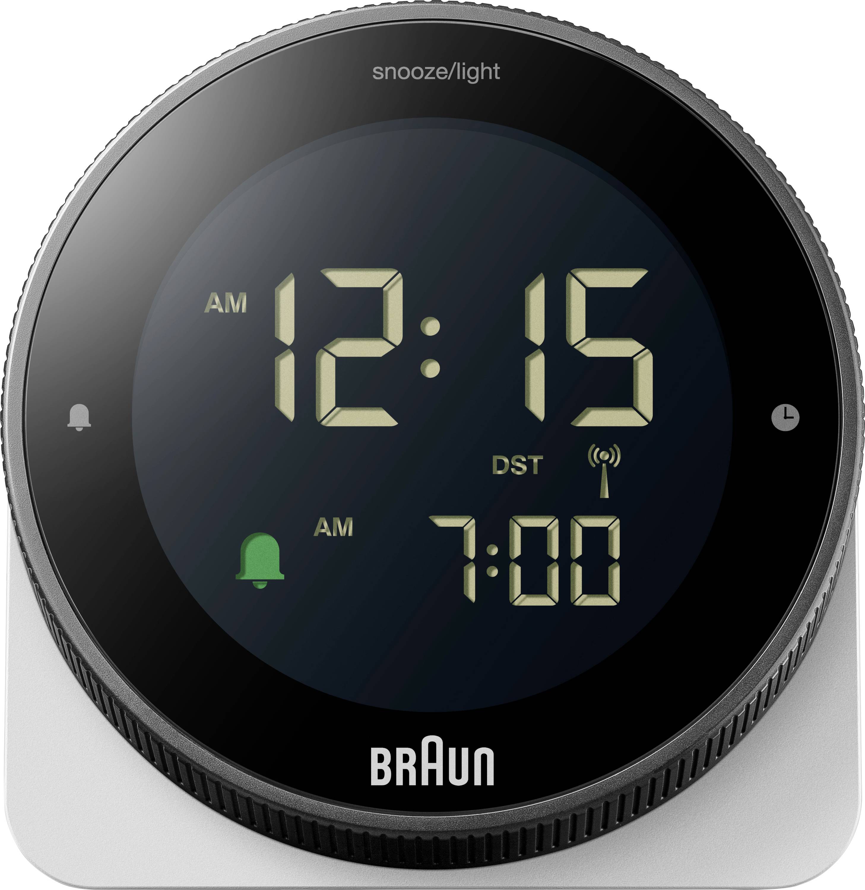 Kulatý digitální budík Braun na stříbrné podstavci zobrazující 12:15 AM s druhým budíkem nastaveným na 7:00 AM a indikátorem letního času.