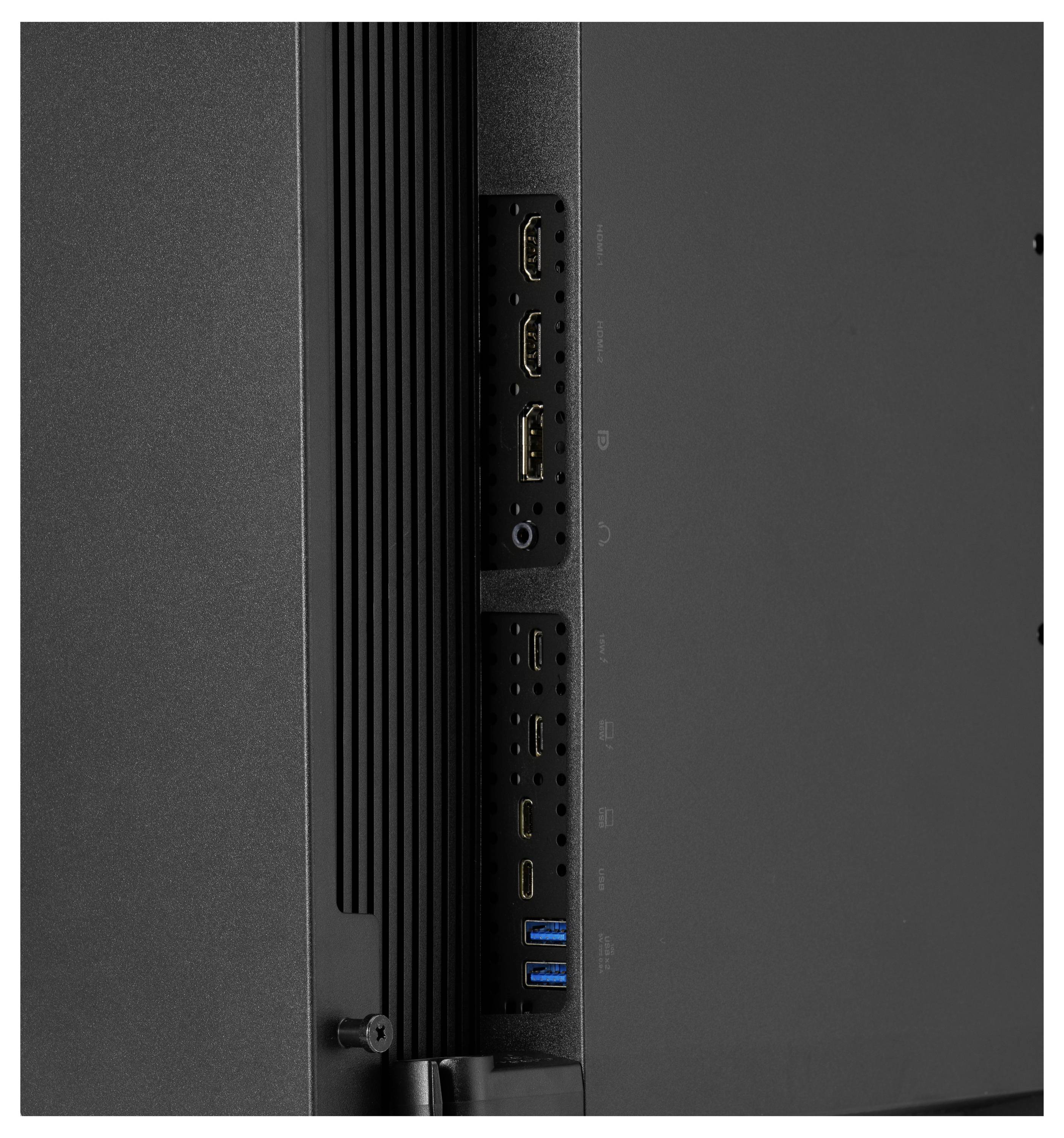 Detailní pohled na zadní vstupní panel monitoru zobrazující více portů, včetně HDMI, USB, audio jacku a napájecích konektorů.