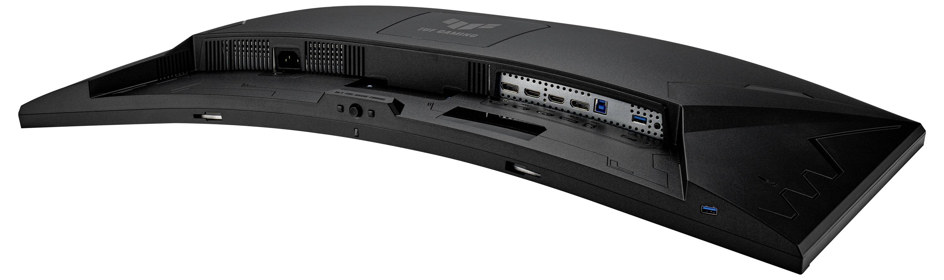 Zadní pohled na zakřivený černý počítačový monitor s viditelnými porty HDMI a dalšími porty na zadním panelu.