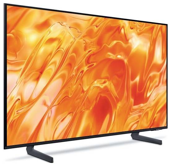 Plochá televize zobrazující abstraktní oranžový a žlutý vířící obraz, zobrazená na bílém pozadí se viditelným stojanem.
