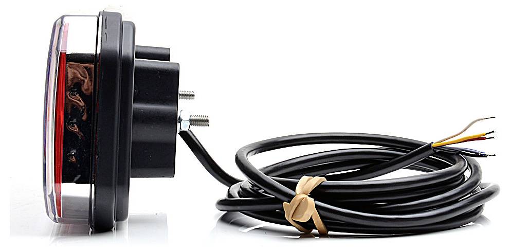 Kulaté černé elektronické zařízení s čirým předním objektivem a spirálovým kabelem s exponovanými konci drátů, zobrazené na bílém pozadí.