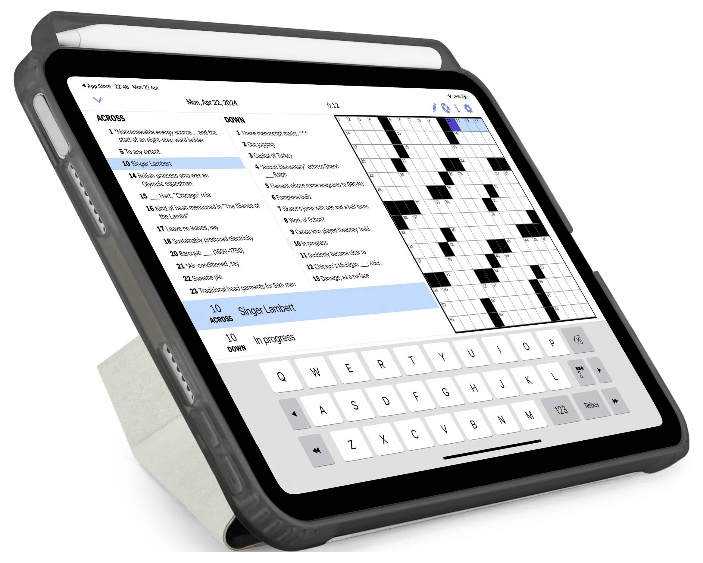 Tablet zobrazující aplikaci křížovky s nápovědami na levé straně, mřížkou puzzle na pravé straně a klávesnicí na obrazovce dole.