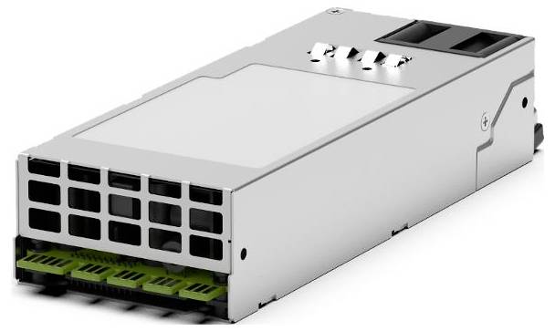Stříbrný obdélníkový elektronický modul s přední ventilační mřížkou, zelenými konektorovými porty a horními svorkami, zobrazený na bílém pozadí.
