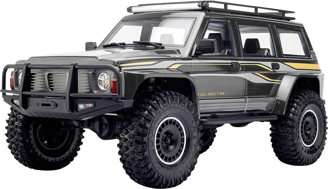 Šedý terenní SUV s přesizednanými pneumatikami, střešním nosičem a žlutým bočním pruhem, zobrazený na bílém pozadí.
