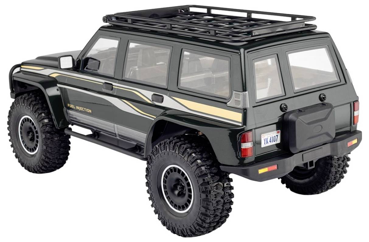 Černý terénní SUV model se střešním nosiči, nadměrnými pneumatikami a krytem náhradní pneumatiky vzadu, zobrazený na bílém pozadí.