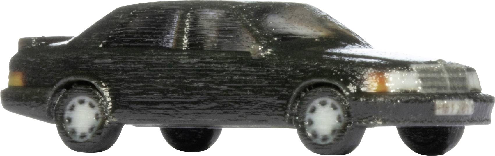 Boční pohled na černé hračkářské auto sedan na bílém pozadí.