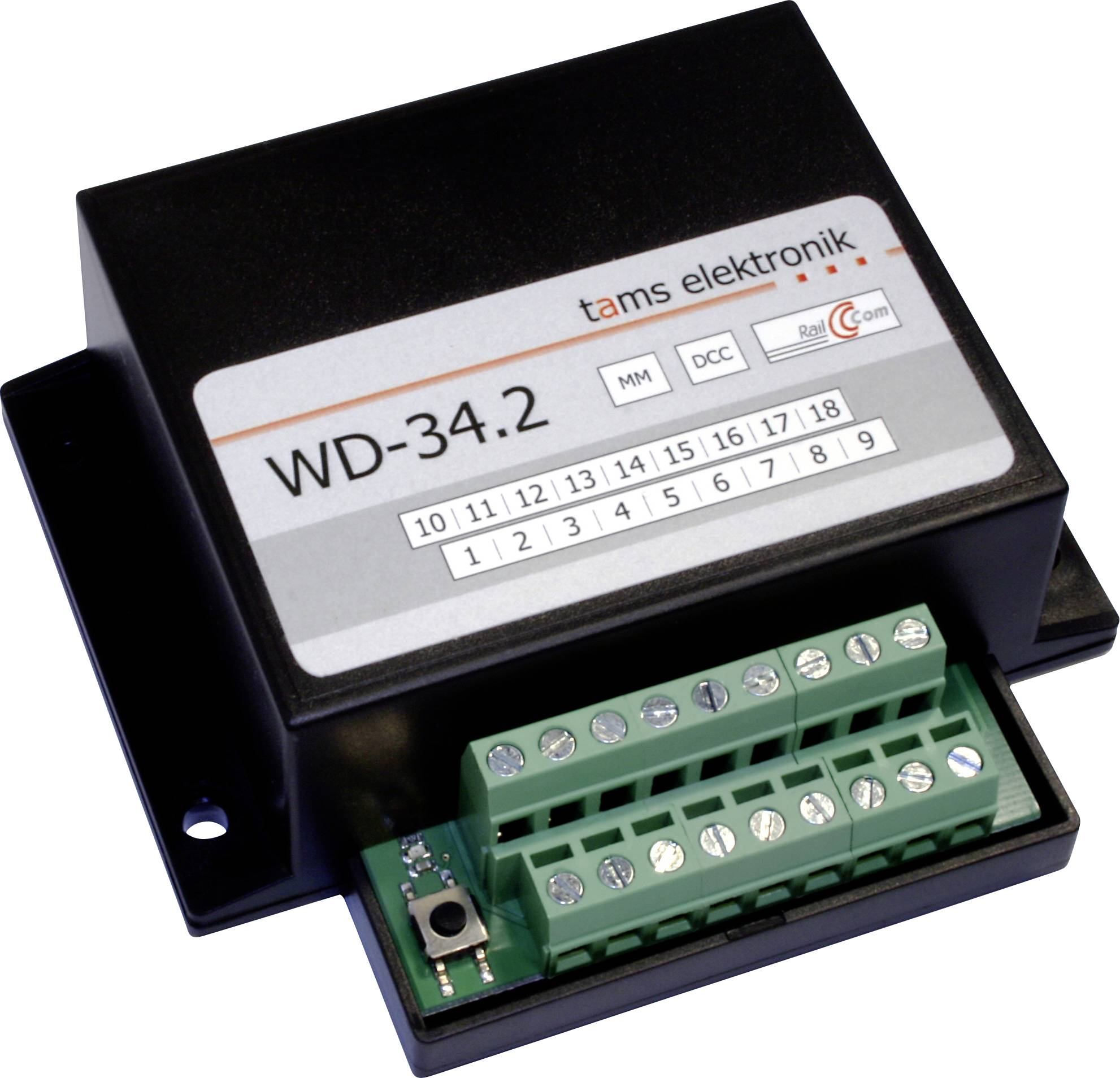 Černý elektronický řídicí modul značený "WD-34.2" se zelenými svorkovnicemi s šrouby.