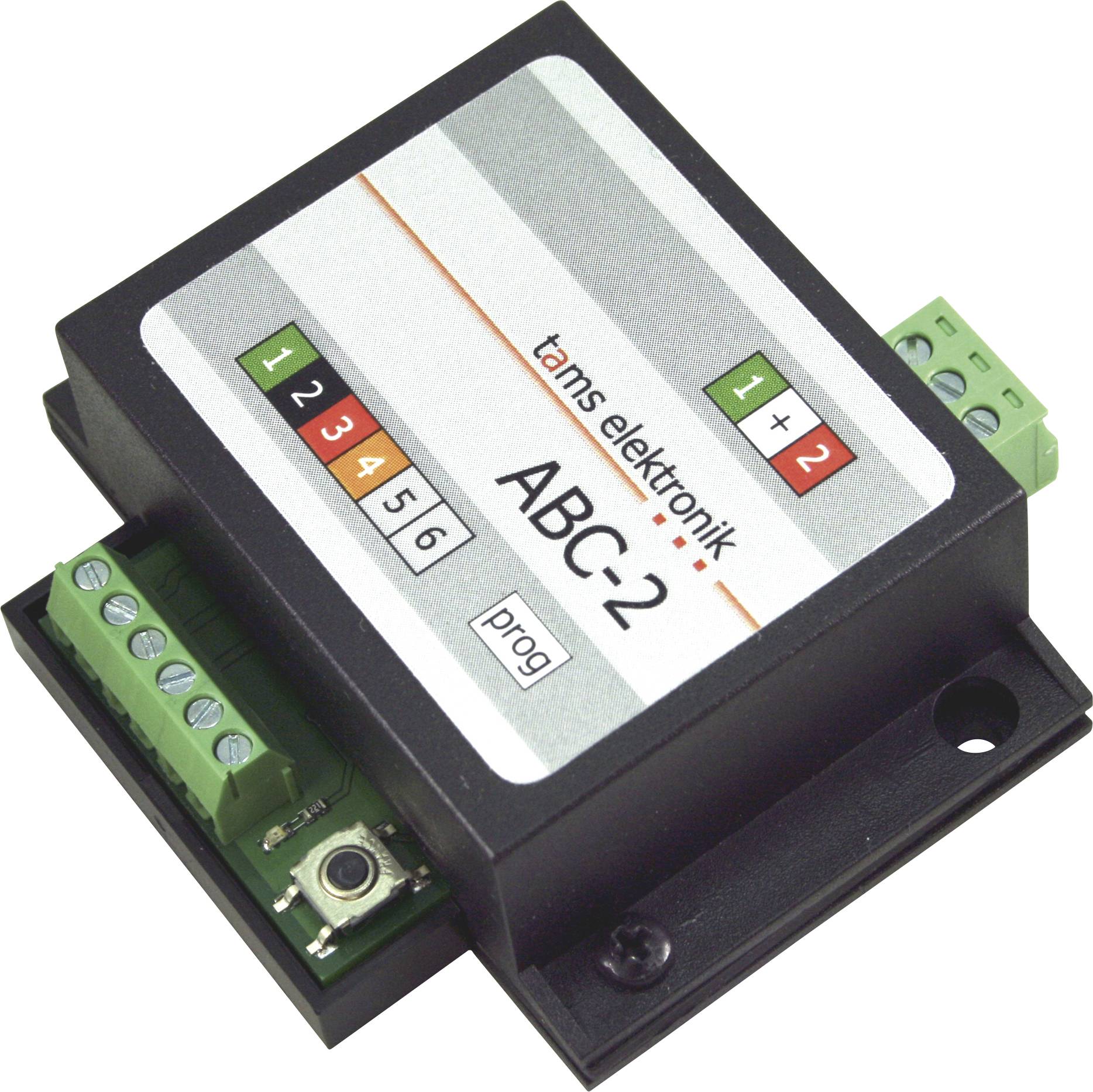 Černý elektronický řídící modul označený "tams elektronik ABC-2" s číslovannými nastaveními a zelenými svorkovnicemi.